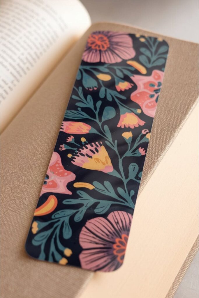 A durable and waterproof bookmark made from high-quality vinyl material, featuring vibrant floral prints with a sleek glossy or matte finish, perfect for long-term use