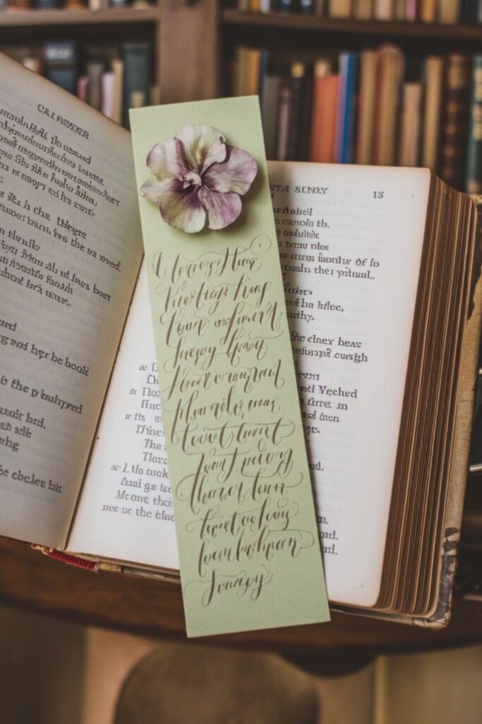 A handwritten poetry bookmark on pistachio green cardstock, placed on an open poetry book